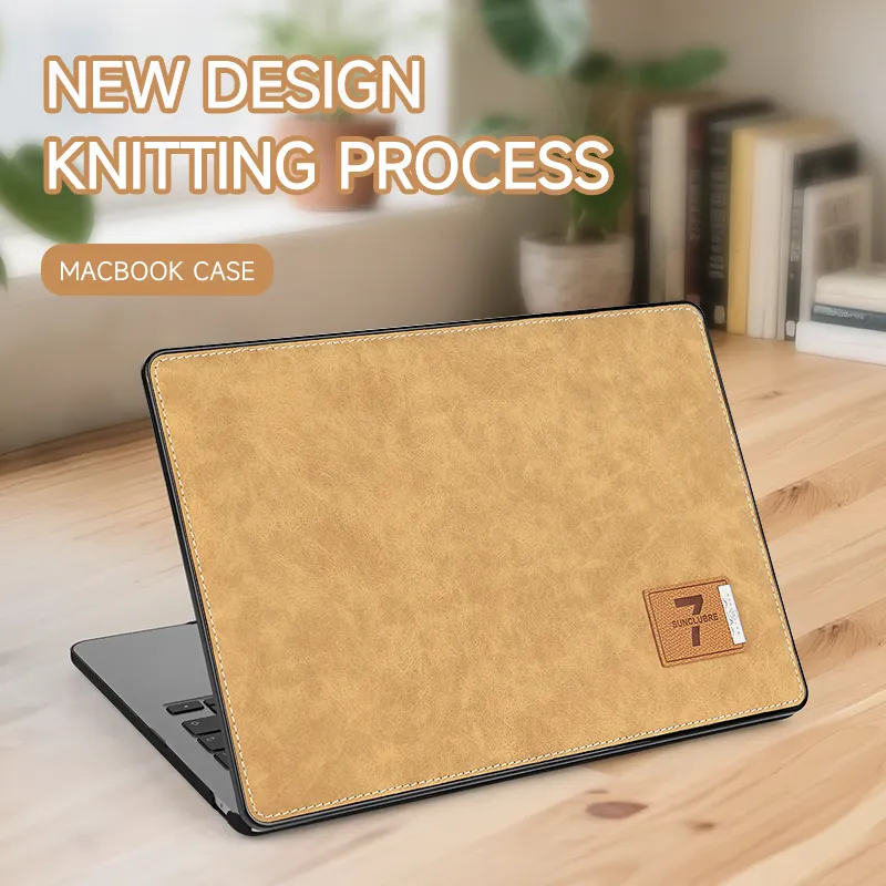 Brown leather pattern MacBook protective case on desk.